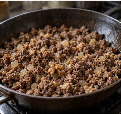 Cook finely crumbled beef, onion and walnut filling.