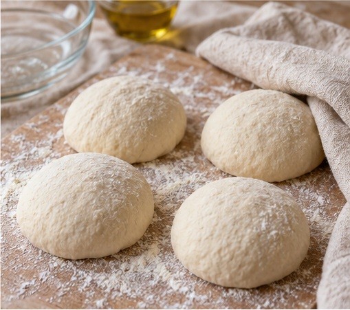 Divide risen dough into four relaxed balls