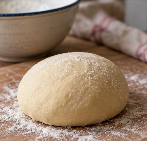 Knead and rest a firm egg-and-water dough.
